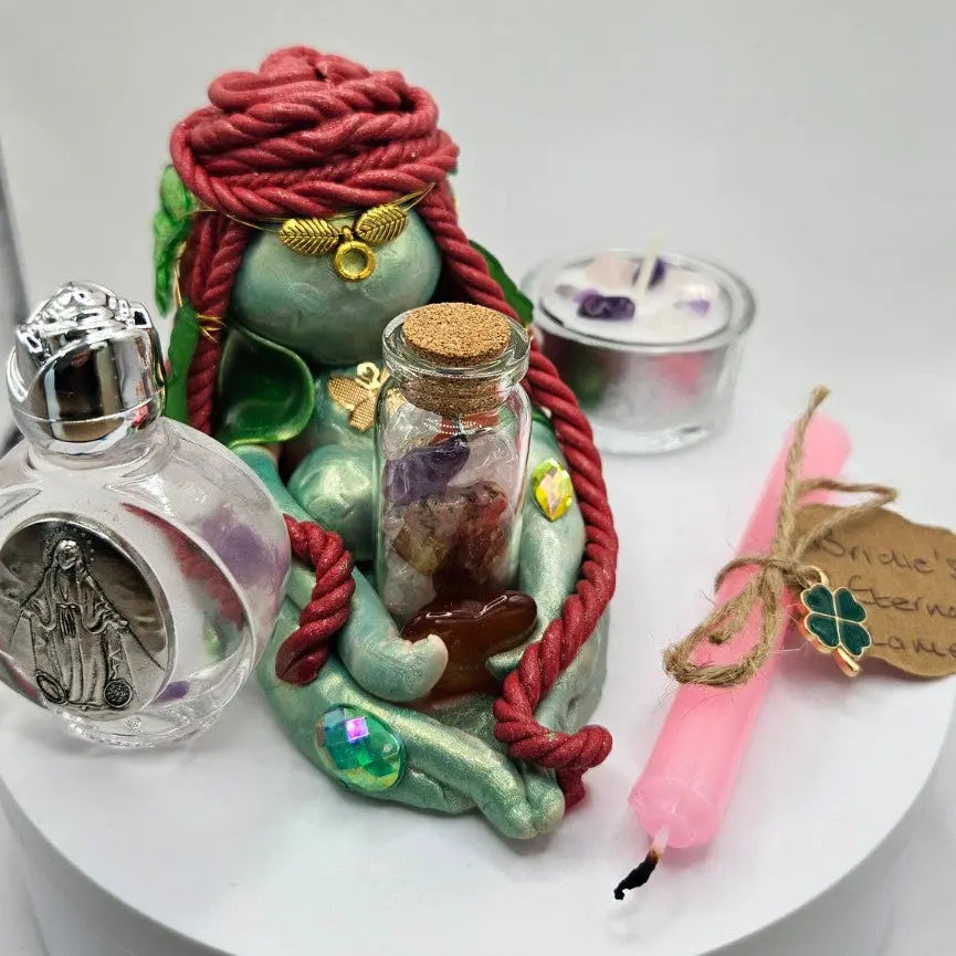 Aisling handmade Goddess Brigid figurine holding crystal vial and carnelian with complete altar set